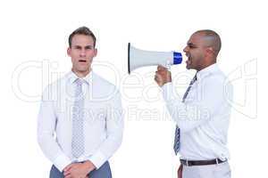 Businessman yelling with a megaphone at his colleague