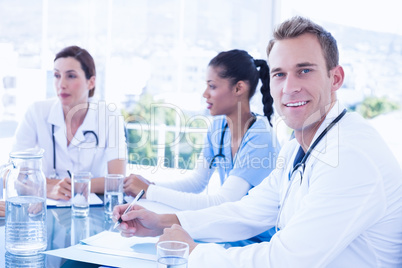 Team of smiling doctors having a meeting