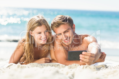 Happy couple taking selfie