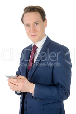 Businessman holding his smartphone and looking at camera