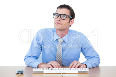 Concentrated businessman typing on the keyboard