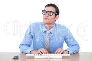 Concentrated businessman typing on the keyboard