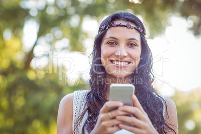 Pretty hipster using her smartphone