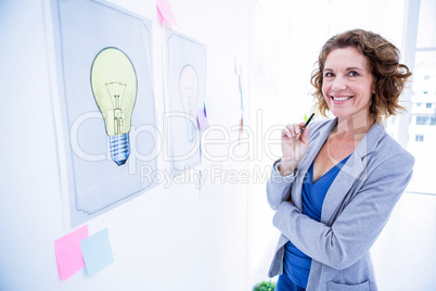 Creative business woman looking at camera