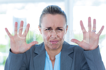 Upset businesswoman showing her hands