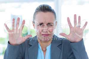 Upset businesswoman showing her hands