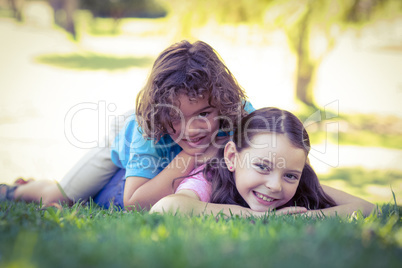 Two happy young kids playing at park