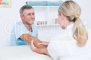 Doctor doing arm massage