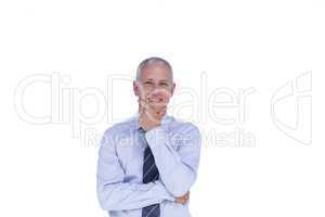 Smiling businessman with head on hand