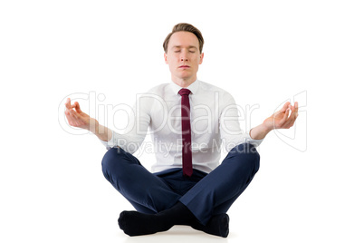 Zen businessman meditating in yoga pose