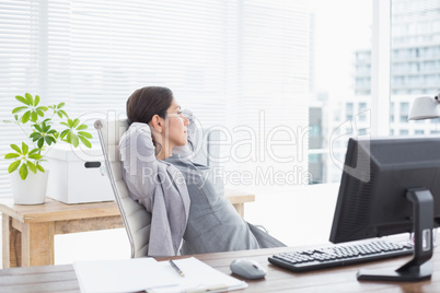 Businesswoman relaxing in a swivel chair Businesswoman relaxing in a swivel chair