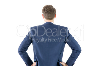 Wear view of businessman with hands on hip