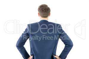 Wear view of businessman with hands on hip