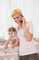 Portrait smiling blonde woman with his son phoning