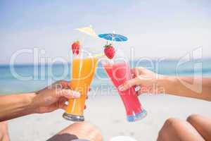 Couple toasting together at the beach