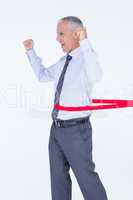 Happy businessman crossing red line