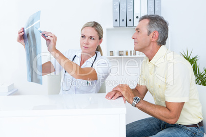 Doctor showing Xrays to her patient