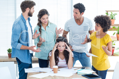 Concentrated businesswoman with her coworkers