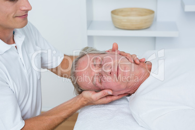 Man receiving neck massage