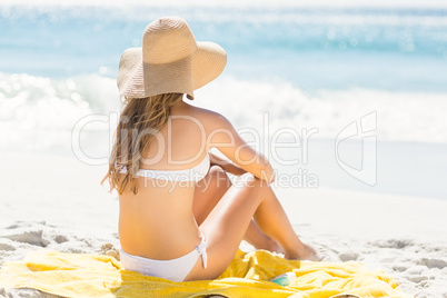 Wear view of blonde woman looking at the sea