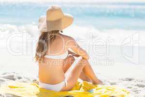 Wear view of blonde woman looking at the sea