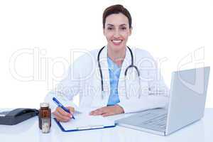 Doctor writing on a notebook