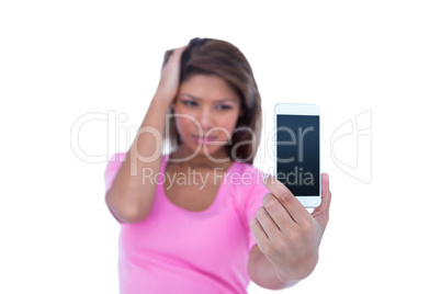 Pretty brunette taking a selfie with smartphone