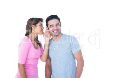 Woman telling secret to her partner