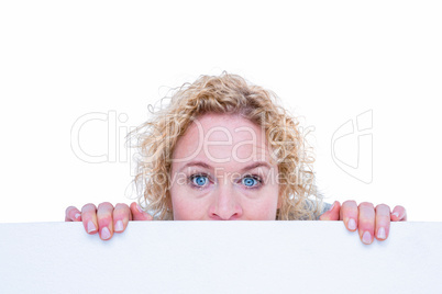 Happy woman holding blank sign