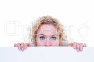 Happy woman holding blank sign