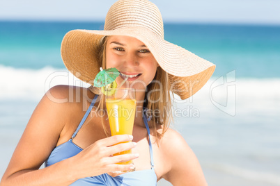 Pretty woman drinking cocktail