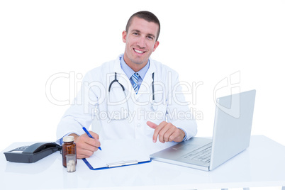 Doctor writing on a notebook