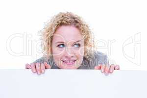 Smiling woman holding blank sign