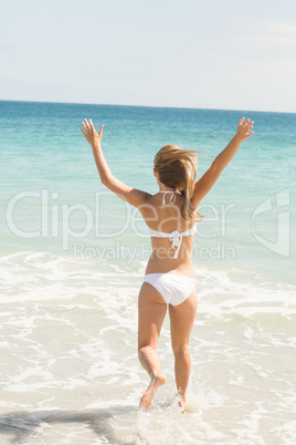 Pretty blonde going into water