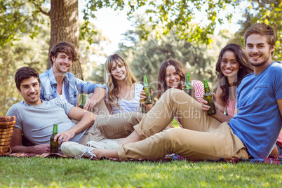 Happy friends in the park having picnic Happy friends in the park having picnic