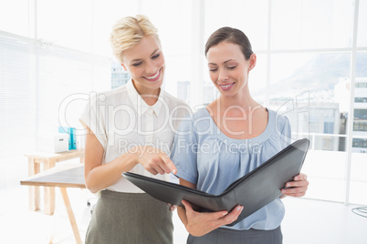 Smiling businesswomen working together