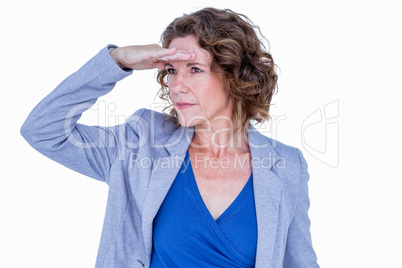 Businesswoman looking away with hand on forehead