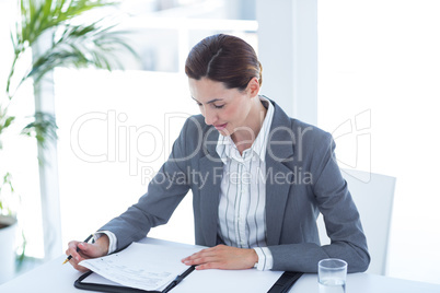 Businesswoman reading file