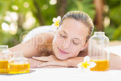 Peaceful blonde lying on towel