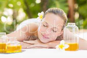 Peaceful blonde lying on towel