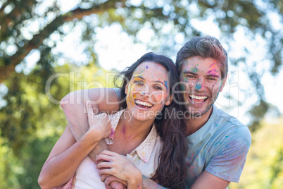 Happy friends covered in powder paint