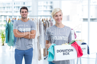 Blonde volunteer holding a donation box