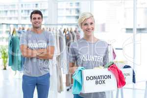 Blonde volunteer holding a donation box