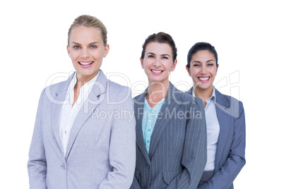 Smiling young businesswomen in a line