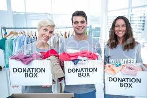 Volunteers friends holding donation boxes