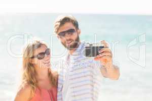 Happy couple taking selfie