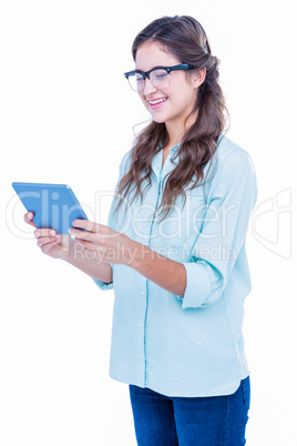 Pretty geeky hipster holding tablet