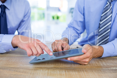 Businessmen using tablet