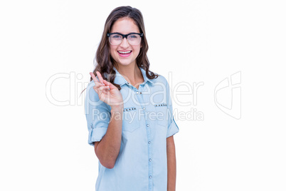 Pretty geeky hipster making peace sign