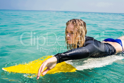 woman with a surfboard on a sunny day